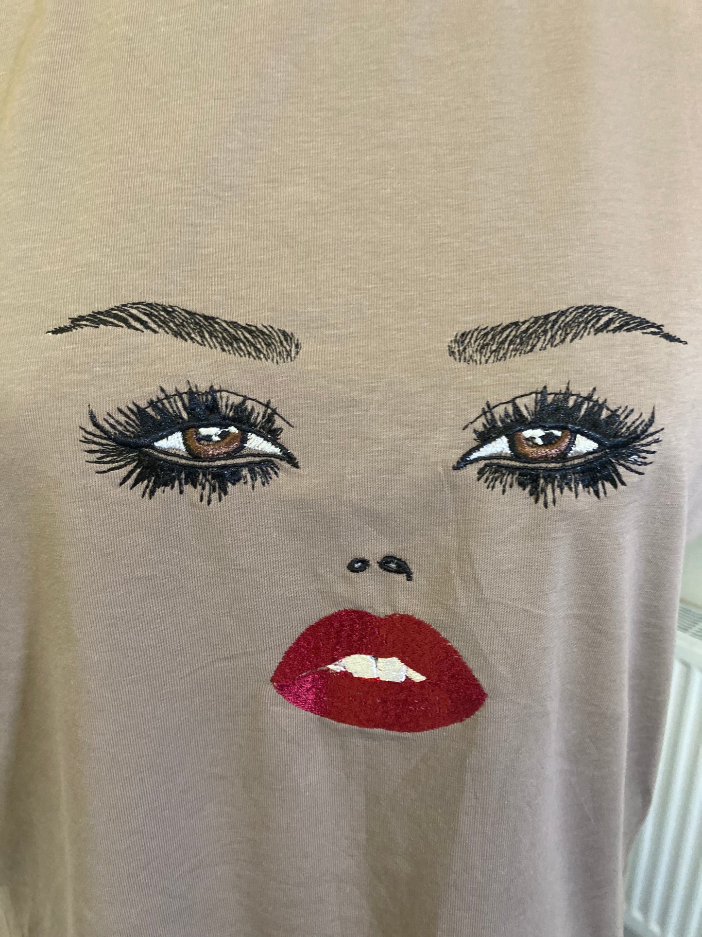 Mink, embroidered face tee size small
